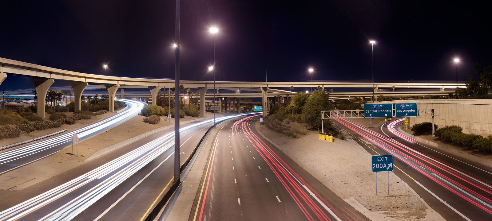 Aerial night view of the Interstate 10 and Interstate 17 stack interchange in Phoenix, Arizona